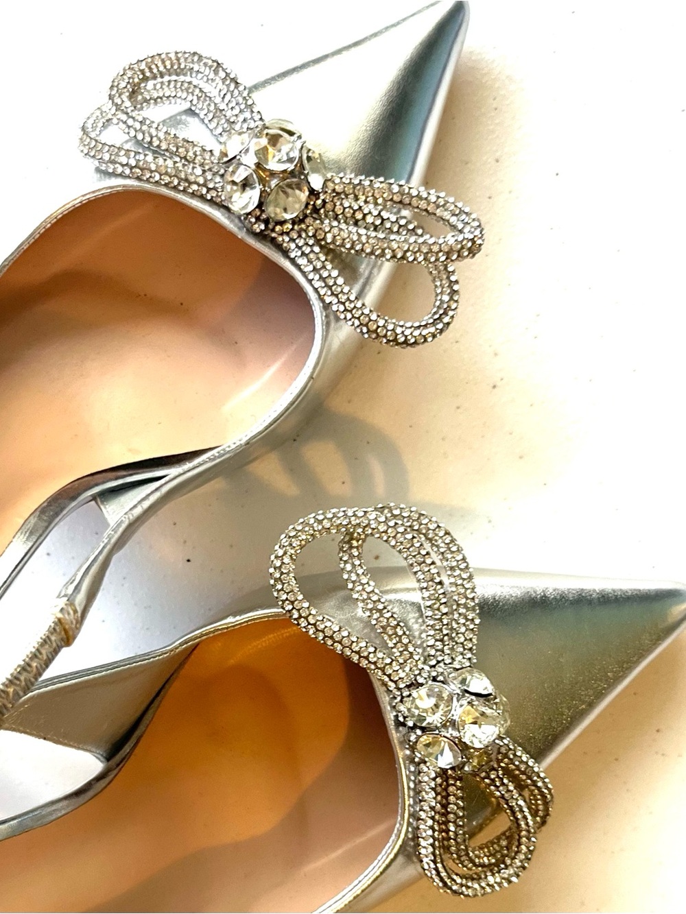 Steve Madden Stilettos - SZ 6.5
3.75” Heel - Metallic Silver Rhinestone Bows